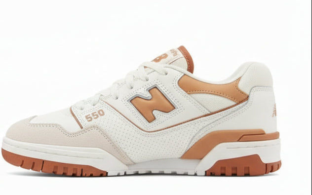 Pair of beige and brown sneakers on a white background