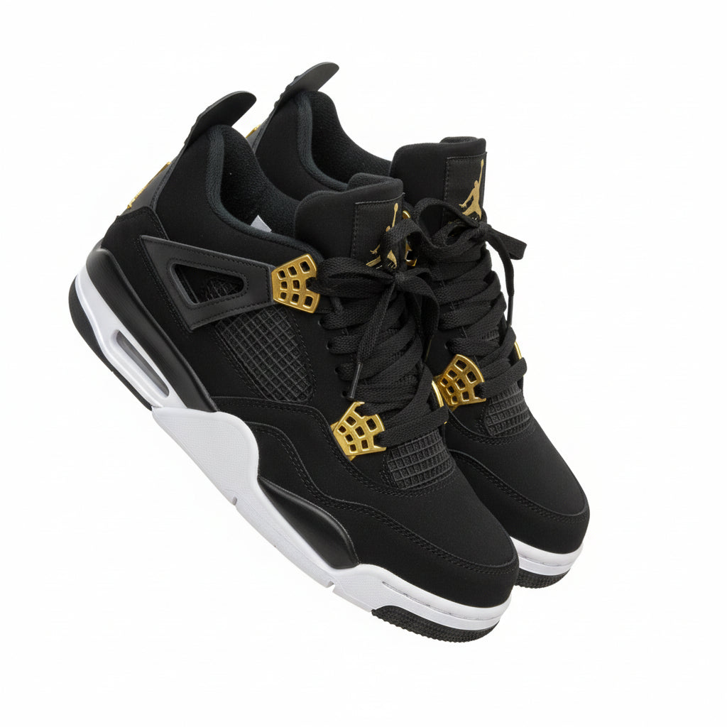 Black sneakers with gold accents on a white chair against a wooden floor background