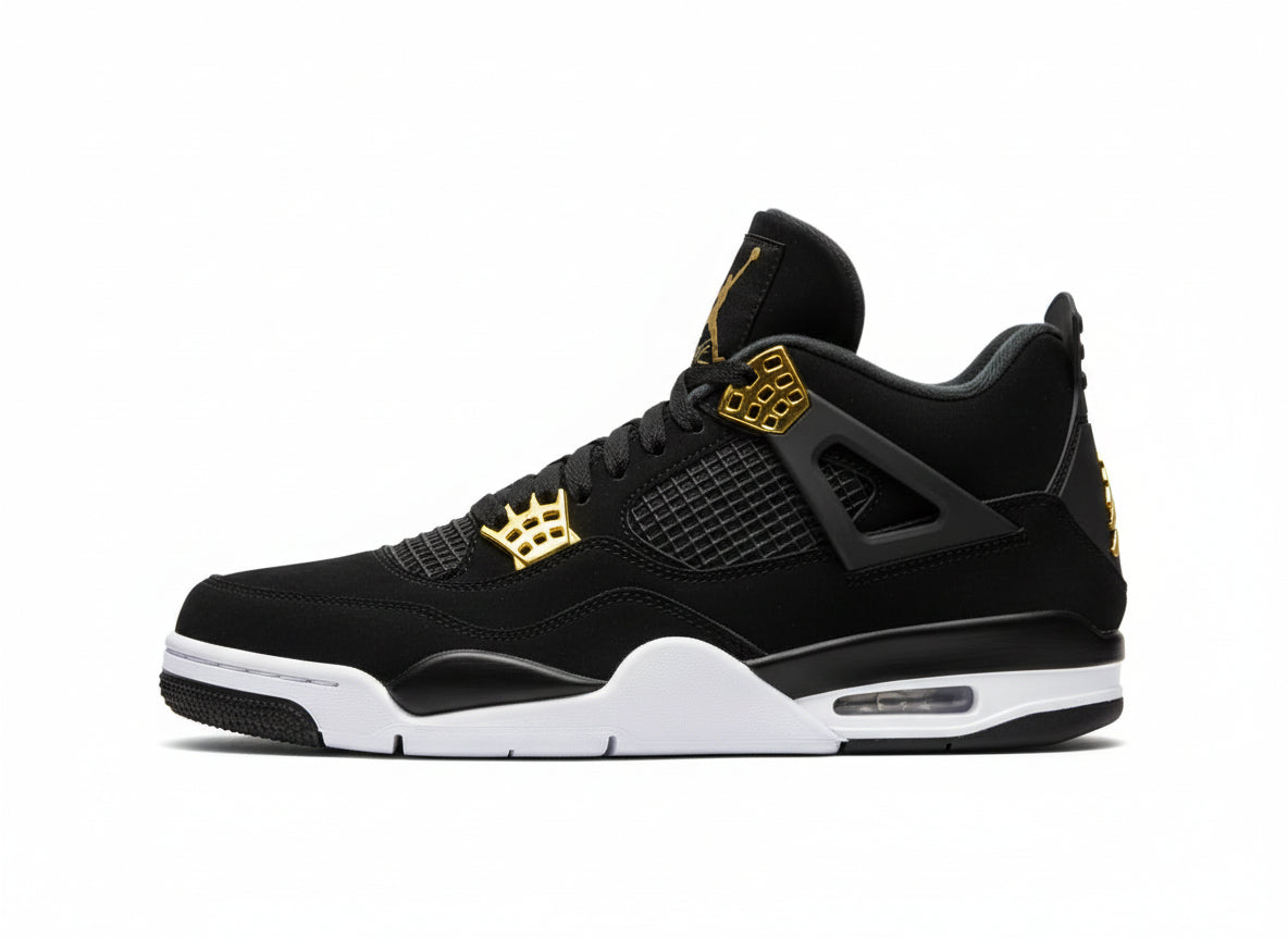 Black and gold sneaker with white sole on a gray surface